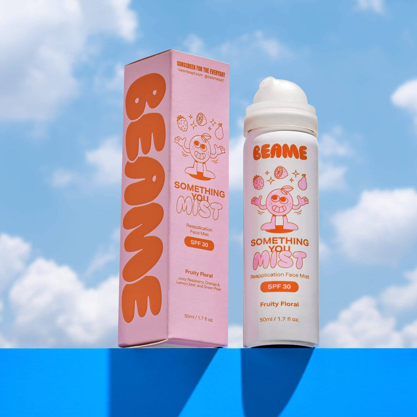 BEAME spray bottle and packaging against a blue sky background